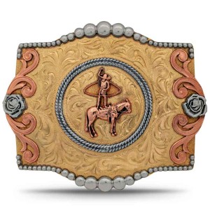 A custom rodeo belt buckle for men featuring a charro on a horse doing rope tricks, built on a golden bronze base with silver roses and copper scrolls